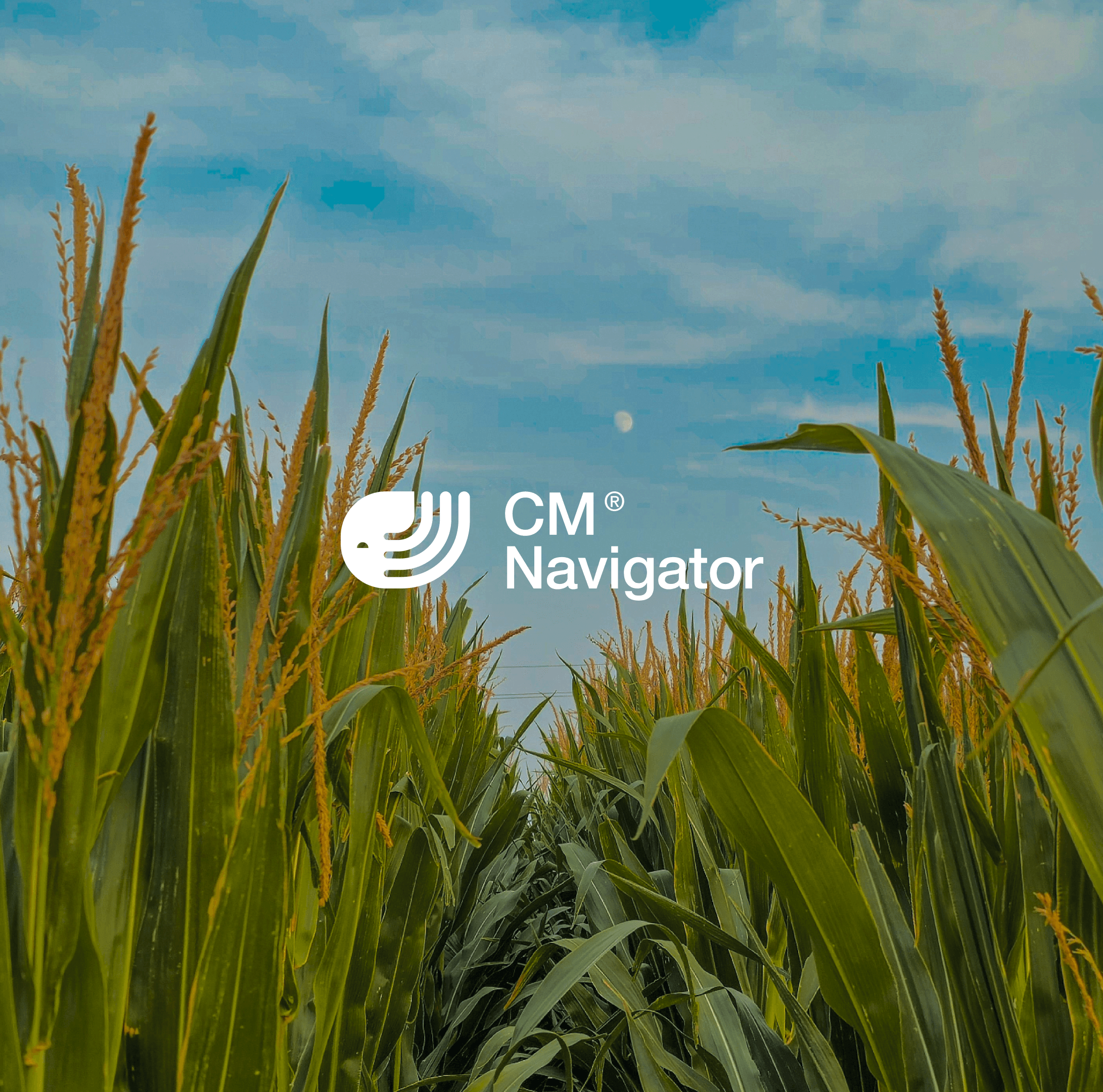 CM Navigator logo over a green cornfield beneath a blue, cloudy sky.