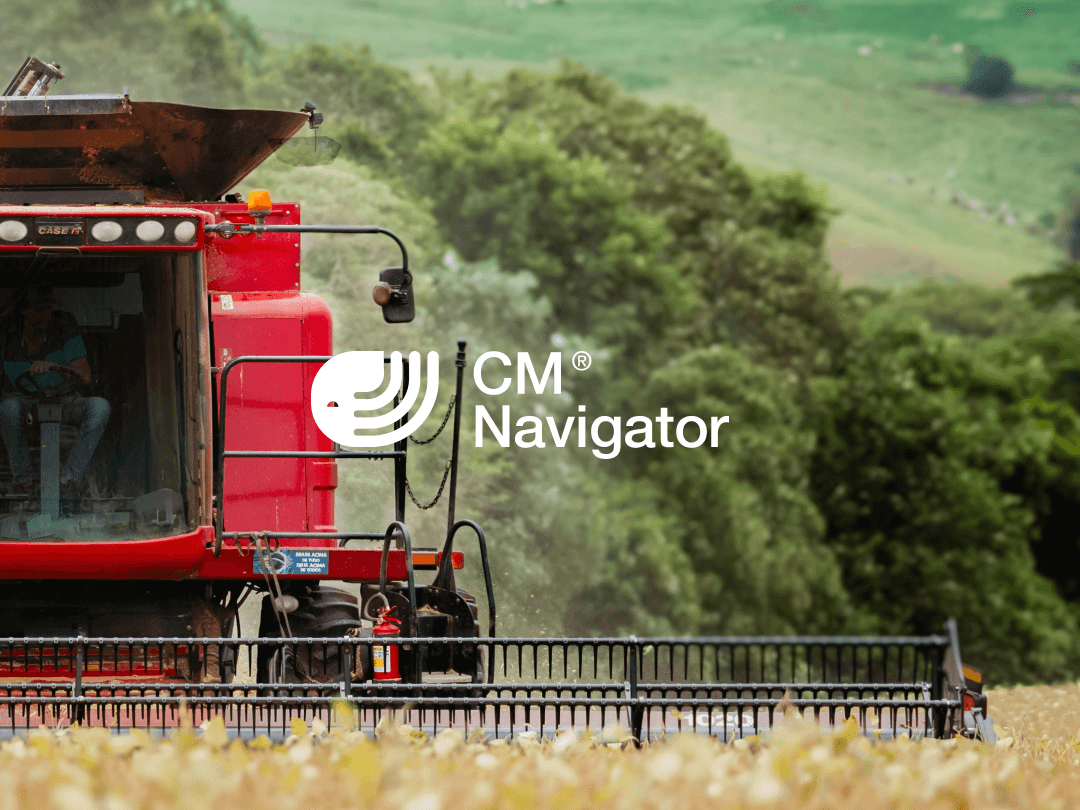Tractor harvesting wheat in a field