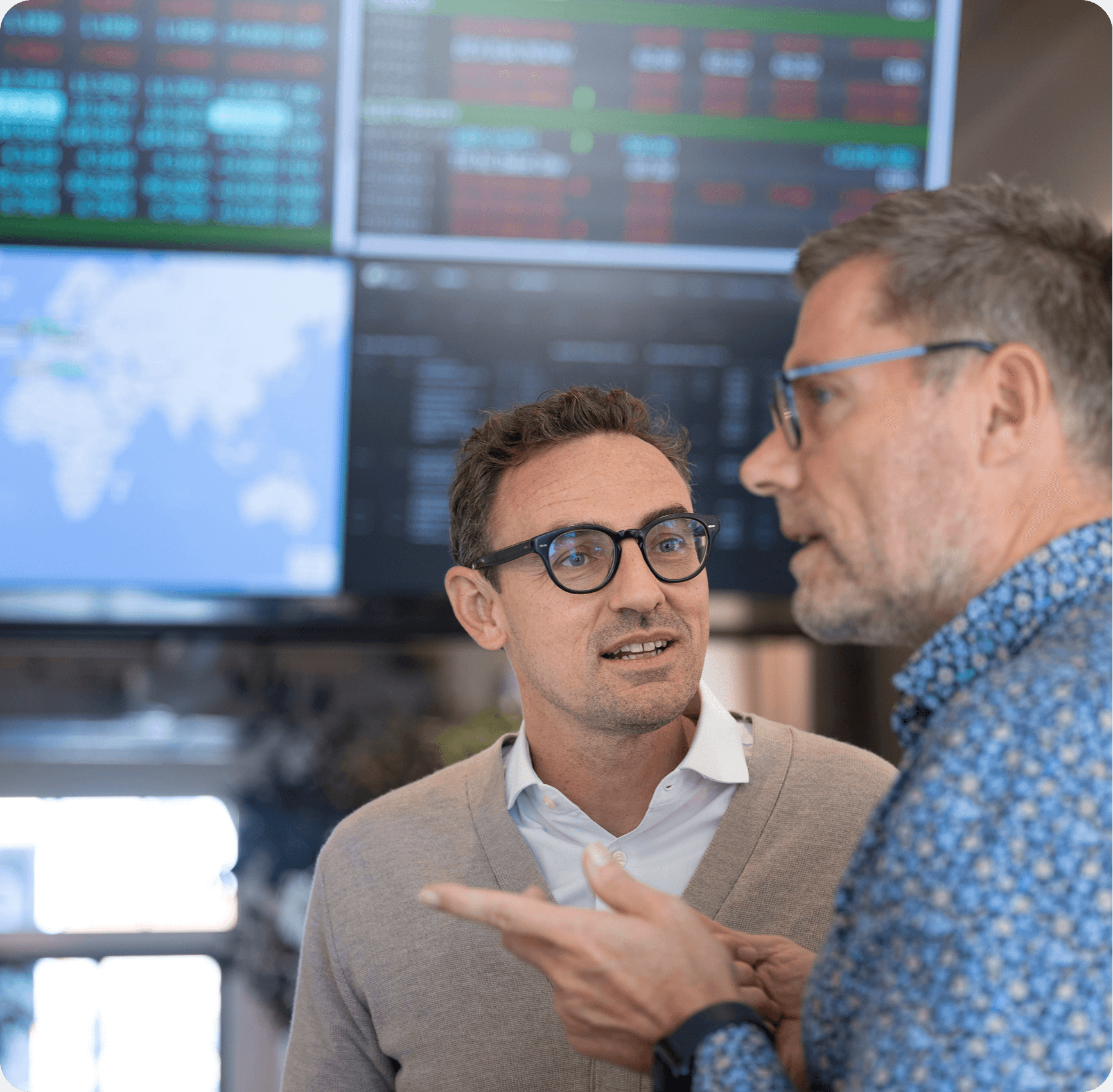 Grain market analyst reviewing commodity price intelligence on a trading screen, representing how physical traders and importers use CM Navigator to make the costs transparent across origins
